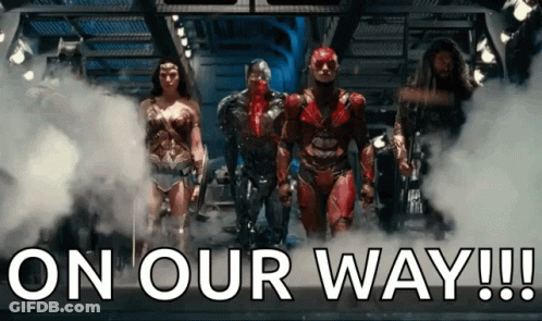A Group Of Superheroes Standing Next To Each Other With The Words " On Our Way " Written Below Them GIF