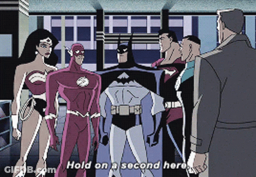 A Group Of Superheros Are Standing Next To Each Other With The Words Hold On A Second Here GIF