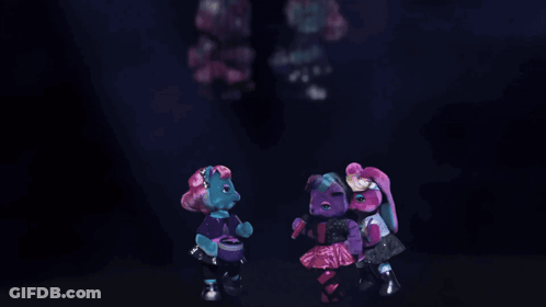 A Group Of Teddy Bears Are Dancing Together In A Dark Room GIF