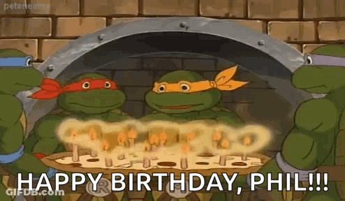 A Group Of Teenage Mutant Ninja Turtles Are Celebrating Their Birthday With A Pizza . GIF