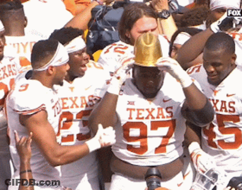 A Group Of Texas Football Players Are Celebrating GIF