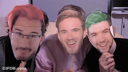 A Group Of Three Men Are Posing For A Picture With Their Faces On A Stick . GIF