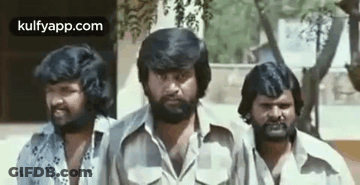 A Group Of Three Men With Beards Are Standing Next To Each Other And Smiling . GIF