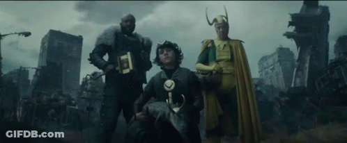 A Group Of Three Superhero Characters Are Standing Next To Each Other In Front Of A City . GIF