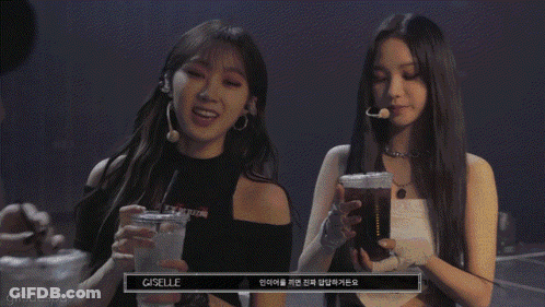 A Group Of Three Women Holding Drinks With T.m.i Written On The Bottom GIF