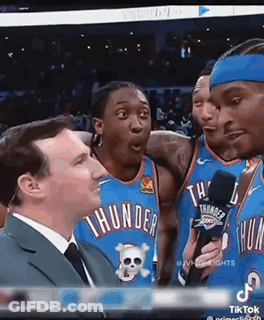A Group Of Thunder Basketball Players Are Talking To A Reporter . GIF