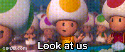 A Group Of Toads Are Standing Next To Each Other With The Words `` Look At Us '' . GIF