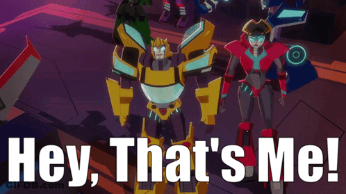 A Group Of Transformers Are Standing Next To Each Other With The Words Hey That 'S Me GIF