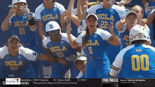 A Group Of Ucla Softball Players Celebrate A Win GIF