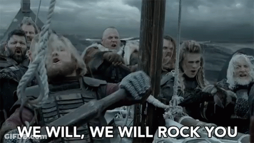 A Group Of Vikings Are On A Boat In The Ocean And One Of Them Is Holding A Large Axe . GIF