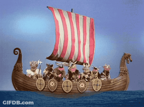 A Group Of Vikings On A Boat With A Red White And Blue Sail GIF