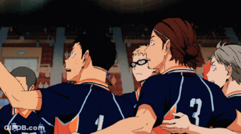 A Group Of Volleyball Players Are Huddled Together And One Of Them Has The Number 3 On The Back Of His Jersey GIF