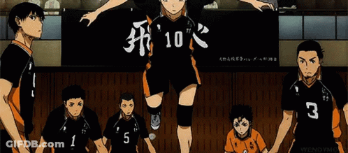 A Group Of Volleyball Players Are Standing Next To Each Other In Front Of A Banner With The Number 10 On It . GIF
