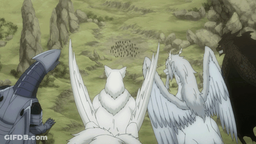 A Group Of White Animals Standing In A Field GIF