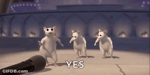 A Group Of White Mice Are Dancing In Front Of A Microphone And Saying Yes . GIF