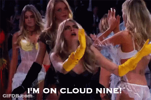 A Group Of Women Are Dancing And One Of Them Is Wearing A Yellow Glove . GIF
