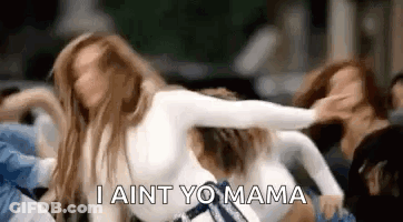 A Group Of Women Are Dancing In A Car And One Of Them Is Saying `` I Ain T Yo Mama '' . GIF
