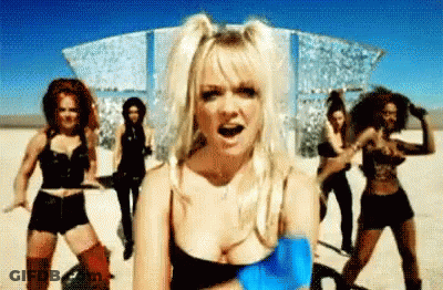 A Group Of Women Are Dancing In A Desert In A Video . GIF