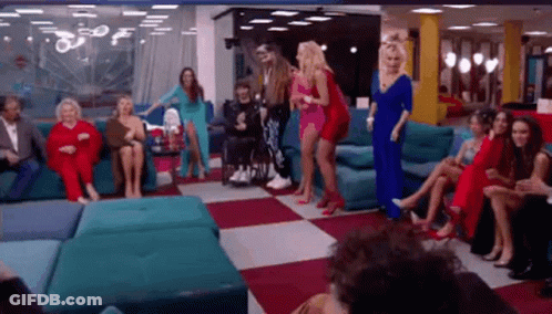 Women Dancing In Living Room With Man In Wheelchair GIF