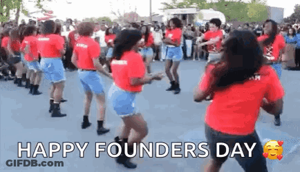 A Group Of Women Are Dancing In Front Of A Crowd . GIF
