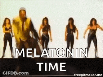 A Group Of Women Are Dancing In Front Of A Man In A Yellow Vest . GIF