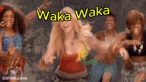 A Group Of Women Are Dancing In Front Of A Sign That Says ' Waka Waka ' GIF