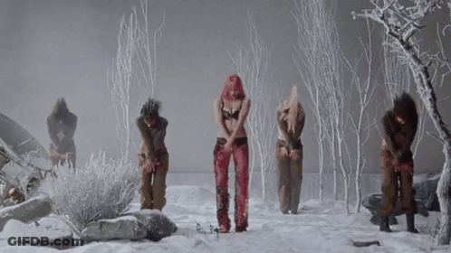 A Group Of Women Are Dancing In The Snow And One Has Pink Hair GIF