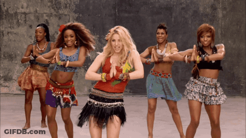 A Group Of Women Are Dancing Together And One Of Them Is Wearing A Red Top GIF