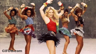 A Group Of Women Are Dancing Together In A Line GIF