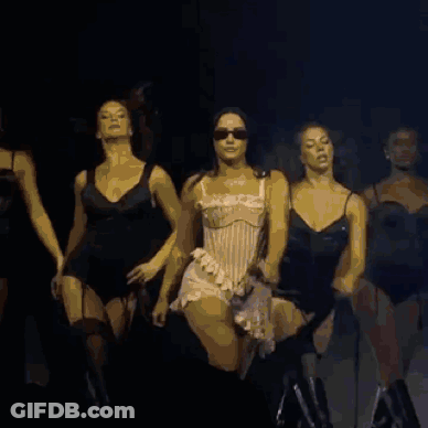 A Group Of Women Are Dancing Together On A Stage GIF
