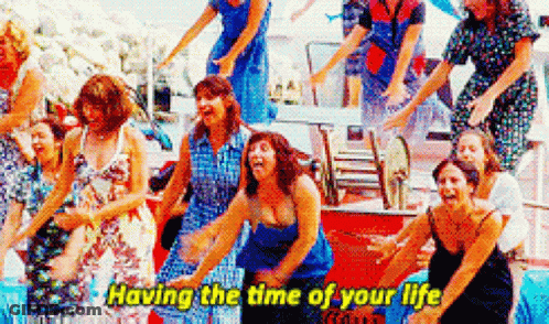 A Group Of Women Are Dancing Together With The Words `` Having The Time Of Your Life '' Written On The Bottom . GIF