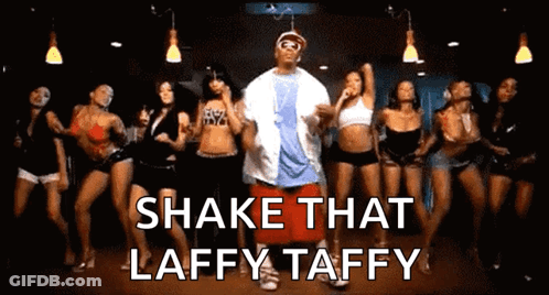 A Group Of Women Are Dancing With The Words Shake That Laffy Taffy In The Background GIF