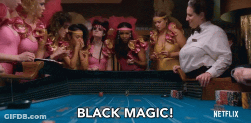 A Group Of Women Are Playing A Game Of Poker And The Words Black Magic Are Visible GIF