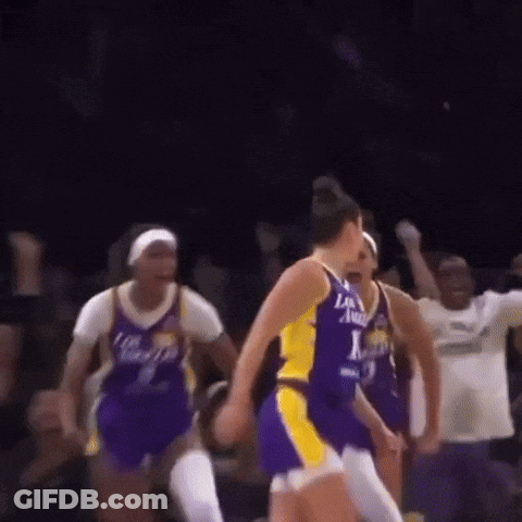 A Group Of Women Are Playing Basketball And One Of Them Is Wearing A Jersey That Says Los Angeles GIF