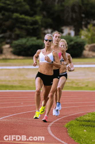 A Group Of Women Are Running On A Track And One Has A Watch On Her Wrist GIF