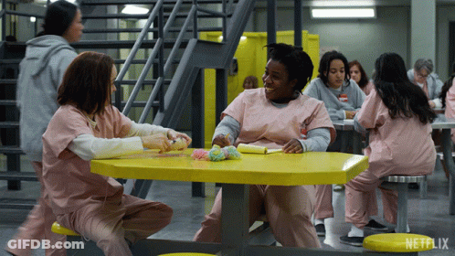 A Group Of Women Are Sitting At A Table With A Netflix Logo In The Corner GIF