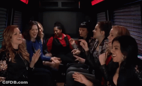 A Group Of Women Are Sitting In A Limo Laughing And Clapping GIF