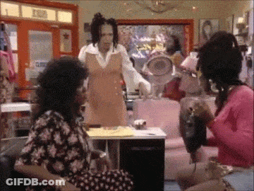 A Group Of Women Are Sitting In A Room With A Sign That Says ' Exit ' On It GIF