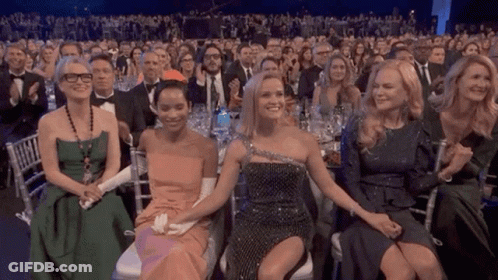 A Group Of Women Are Sitting In A Row At A Awards Show GIF