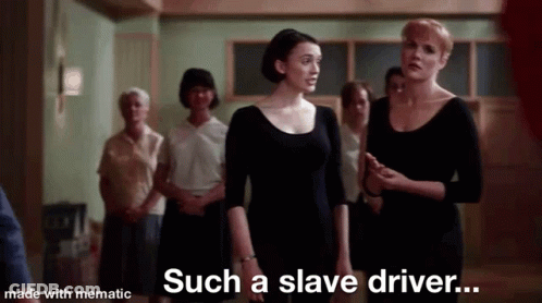 A Group Of Women Are Standing In A Room Talking To Each Other . GIF