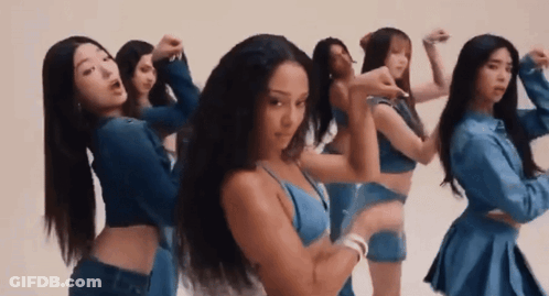 A Group Of Women Are Standing Next To Each Other And Dancing In Front Of A White Background . GIF
