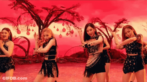 A Group Of Women Are Standing Next To Each Other In Front Of A Red Background . GIF