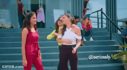 A Group Of Women Are Standing On A Set Of Stairs With The Words @Seriously Below Them GIF