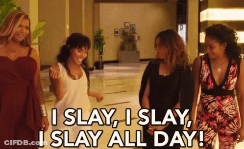 A Group Of Women Are Walking Down A Hallway And One Of Them Is Saying I Slay I Slay GIF
