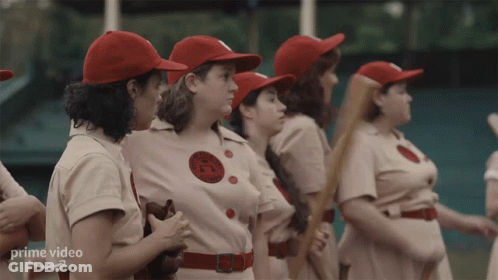 Women In Baseball Uniforms Standing In Line GIF