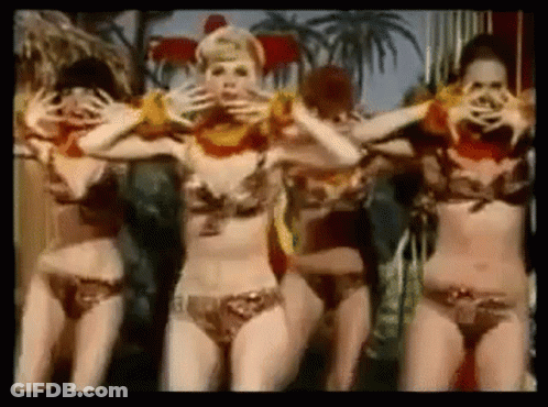 A Group Of Women In Bikinis Are Dancing And Covering Their Faces . GIF