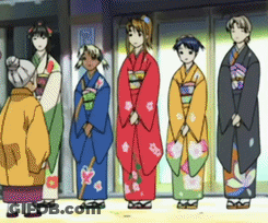 A Group Of Women In Kimonos Are Standing In A Line GIF