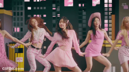 A Group Of Women In Pink Dresses Are Dancing Together GIF