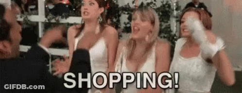 A Group Of Women In White Dresses Are Standing Next To Each Other And A Man Is Standing Behind Them . GIF