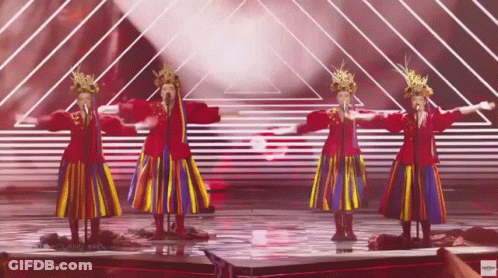 A Group Of Women Singing On A Stage With A Youtube Logo In The Lower Right Corner GIF